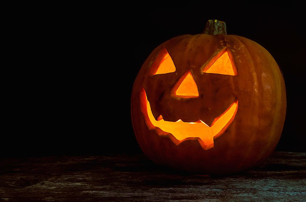 Motorcycle Training Blog Halloween pumpkin with a carved face glowing orange, symbolizing festive spirit for motorbike riders' costume ideas.