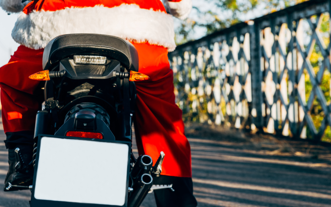 Motorcycle Training Blog Motorcycle with rider dressed as Santa Claus on a bridge, symbolizing festive motorcycle training and holiday spirit.